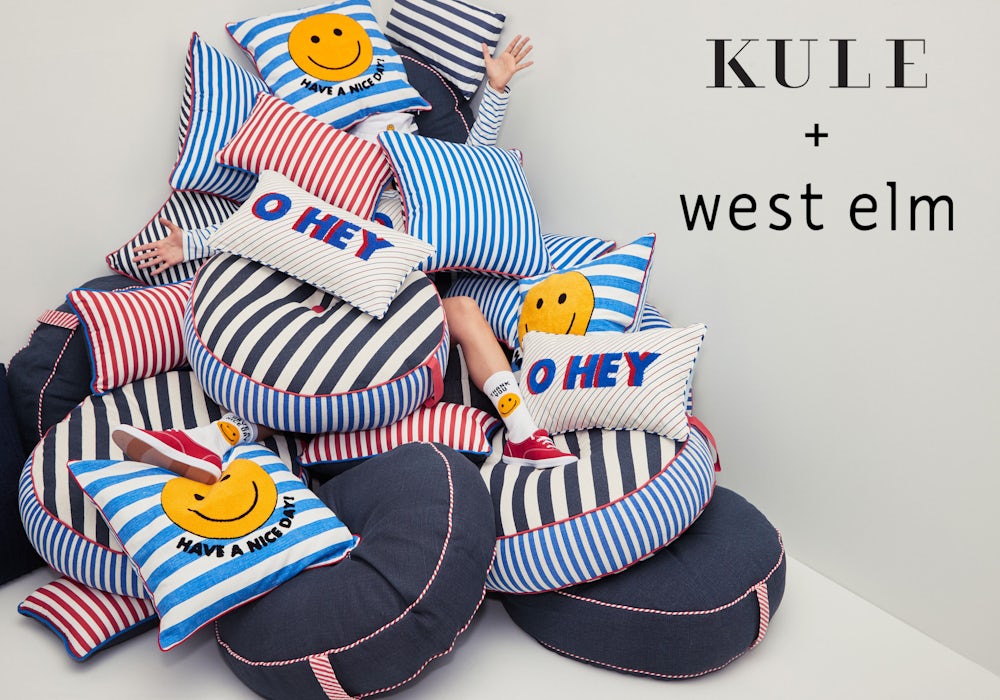 Kule x West Elm collaboration shot with KULE’s chief of staff covered in a stack of fallen pillows.